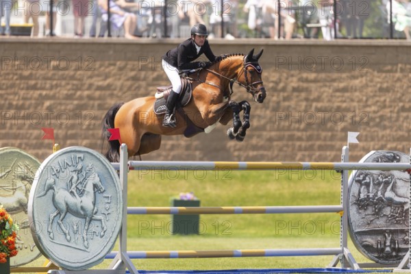 Darragh Kenney of Ireland and riding Eddy Blue, compete in the 1.60m Grand Prix during The