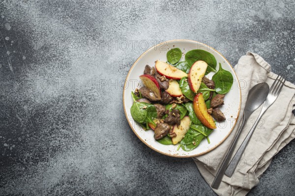 Healthy Salad with Iron Rich Ingredients Chicken Liver, Apples, Fresh Spinach and Walnuts on White