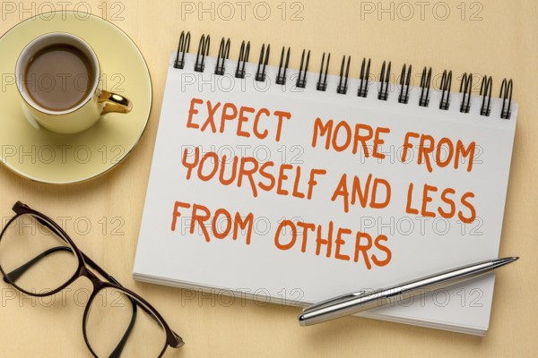 Expect more from yourself and less from others - inspirational handwriting in a sketchbook, a flat