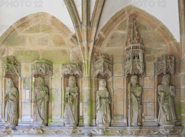 Statues of the apostles in the covered side entrance, enclosed parish Enclos paroissial, Eglise