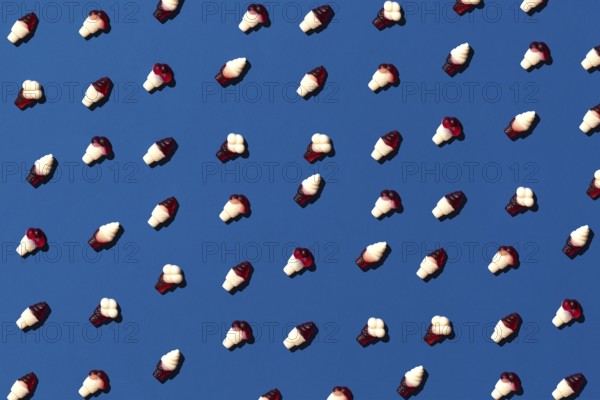Flat lay photo tasty concept, minimal Sweet Candy jelly bean Colorful pattern on blue pastel