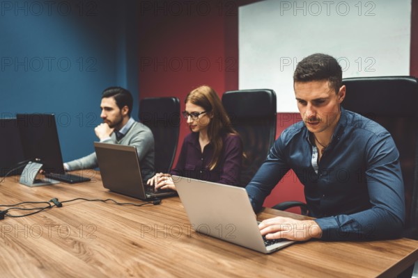 Start up company, young caucasian business people at work, brainstorming ideas, working on
