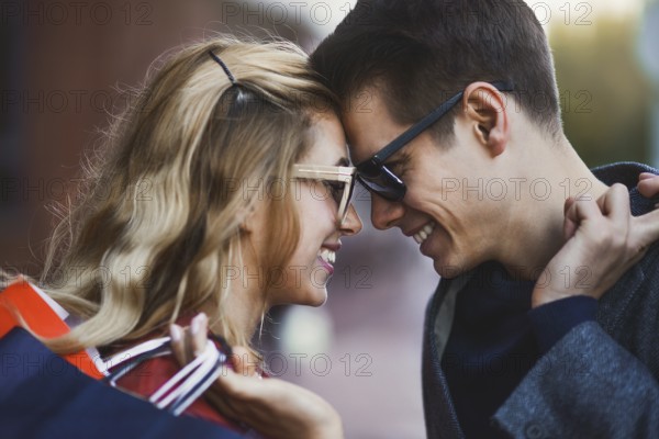 Picture showing young couple shopping in the city. Portrait of a couple with shopping bags in the
