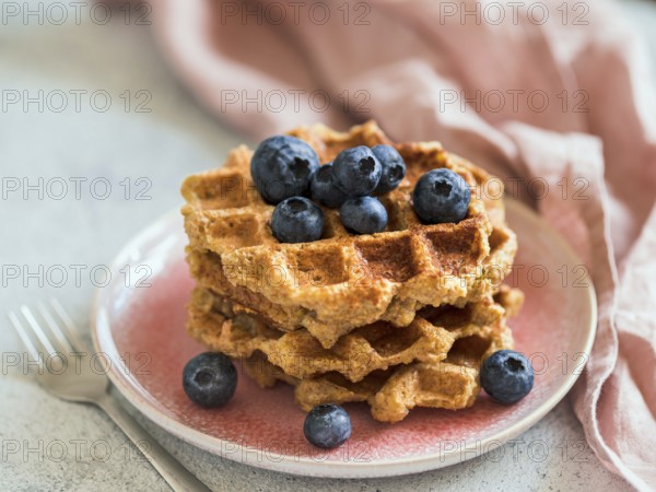 Easy healthy gluten free oat waffles with copy space. Stack of appetizing homemade waffles with oat