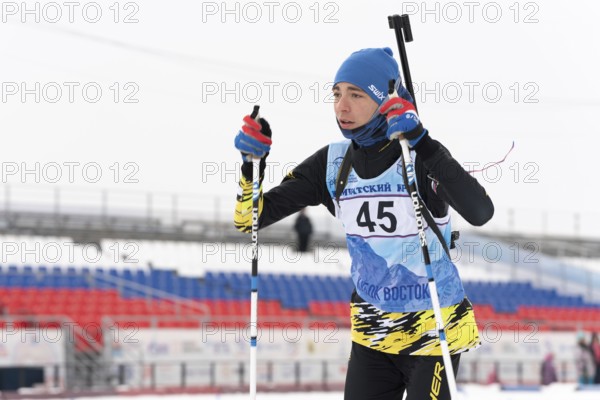 Kamchatka sportsman biathlete Storonkin Nikita skiing on distance biathlon stadium. Open regional