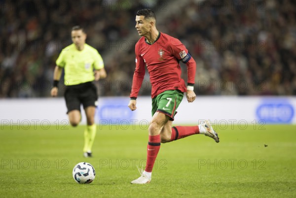 Football match, captain Cristiano RONALDO CR7 Portugal on the ball running towards the left looking