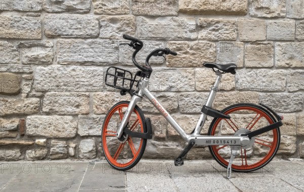 Mobike bicycle meant for bike sharing, parked in public area. Mobike a popular bike sharing