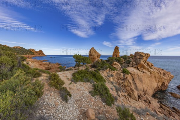 Coastal landscape with bizarre red rocks and sea view, Spiaggia di Cala E'Luas, Ogliastra,