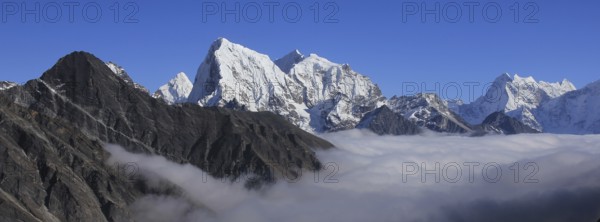 Sea of fog and peaks of Ama Dablam, Cholatse and Tobuche