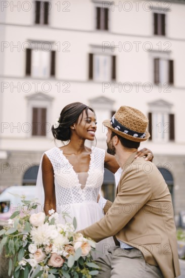 Multiracial wedding couple. Wedding in Florence, Italy. African-American bride in a white dress