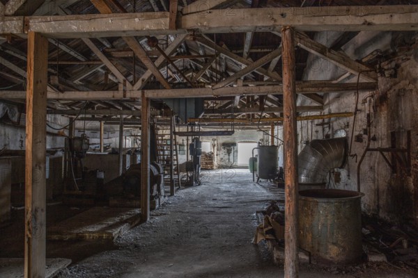 Old abandoned paper factory. Historic and typical factory building as a lost place. Destruction and