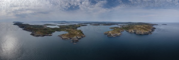 A wide panorama landscape of the islands and coastline of Baltimore Harbor in West Cork County in