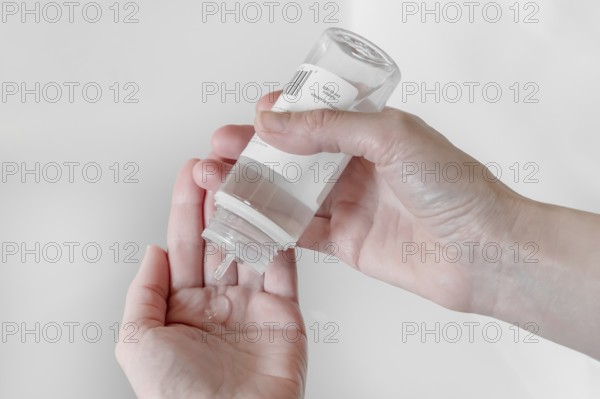 Hand sanitizer gel. Disinfecting hands. Taking disinfection alcohol gel on hands to prevent virus