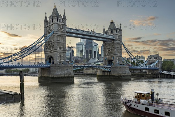 View over the Thames with Tower Bridge and the skyline in the evening light, London, England, Great