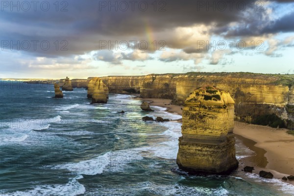 The rocks Twelve Apostles in an ocean storm surf. Travel to Australia. Fantastic morning light on
