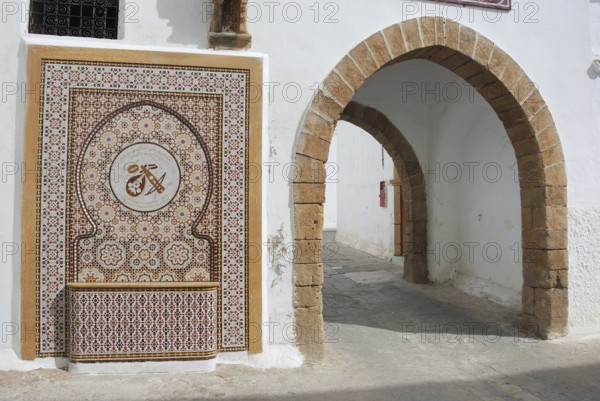 Casablanca Quartier Habous, An ornate mosaic with a traditional archway, featuring intricate