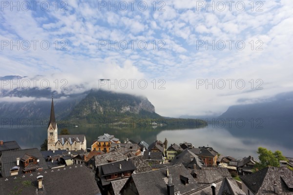 The most picturesque small town in Austria - Hallstatt. Slender bell tower and the church on the