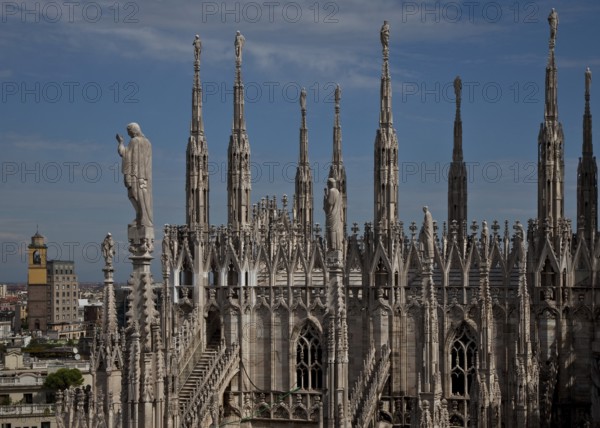 West side of the north transept, upper part with 19th-century pinnacles bearing lashings and