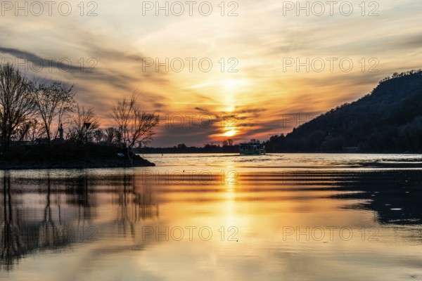 Morning atmosphere on the river, cruise ship on the Danube, near Rossatz, golden hour at sunrise,