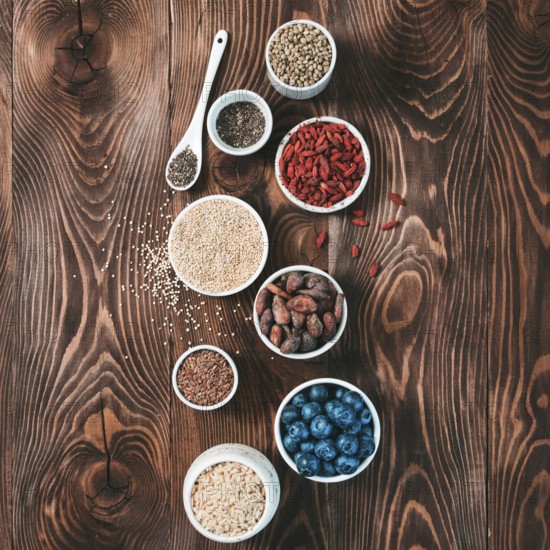 Various superfoods in small bowl on wooden table.Selection super food.Superfood as blueberry, chia,