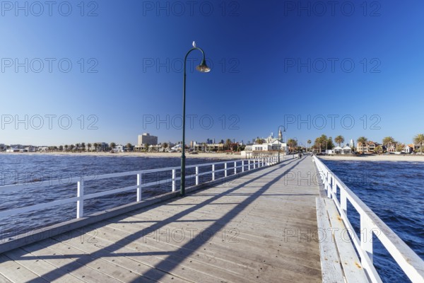 Kerford Rd Pier around Albert Park Yachting & Angling Club in Albert Park at sunset on a winter's