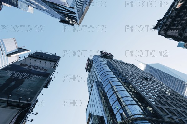 New York City, USA, June 25, 2018: Low angle view of skyscrapers in Times Square in Midtown, North