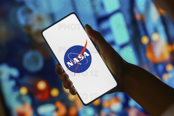 In this photo illustration, the NASA (National Aeronautics and Space Administration) logo is