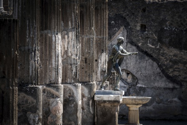 POMPEII, ITALY, MAY 04, 2022, Colonnade and sculptures of the Temple of Apollo near the Pompeian