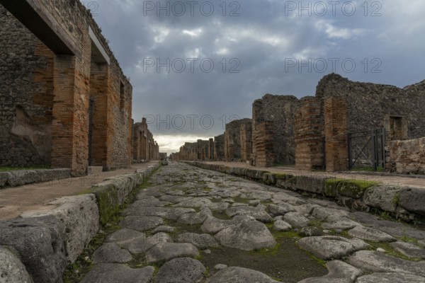 Pompei, Italy, 25 November, 2023: tyoical city street and houses in the ancient Roman town of