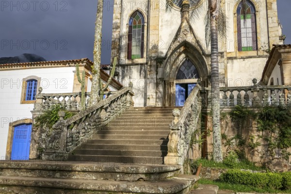 View to entrance stairway of church in sunlight, Sanctuary Caraca, Minas Gerais, Brazil, South