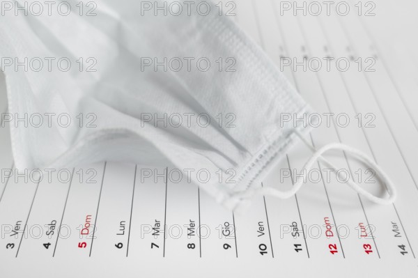 Montly calendar with self protection face mask. Coronavirus concept. Beginning / end of the