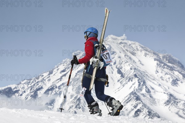 AVACHA VOLCANO, KAMCHATKA, RUSSIA, APR 21, 2012: Open Cup of Russia on ski-mountaineering. Girl ski