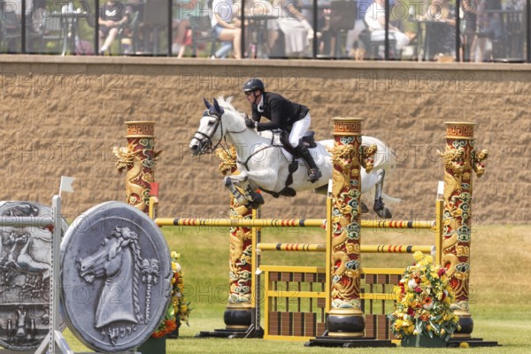 Daniel Coyle of Ireland and riding Incredible, compete in the 1.60m Grand Prix during The