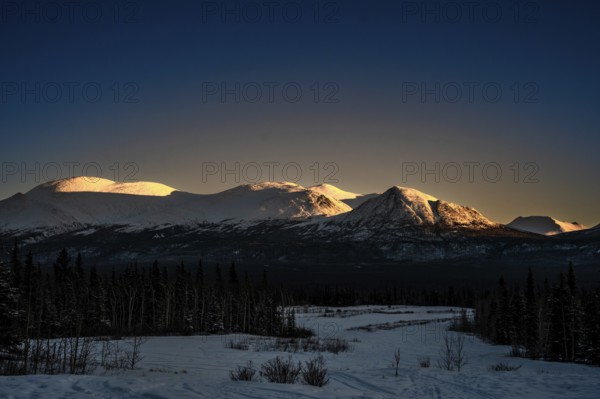 Snow-covered mountains in the light of the sunset, Yukon, Canada, Kluane National Park, North