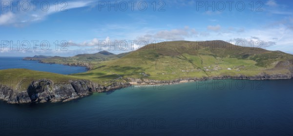 Landscape view of the turquoise waters and golden sand beach at Slea Head on the Dingle Peninsula