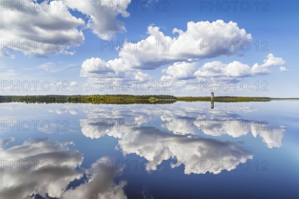 Landscape with a symmetrical reflection on the Vyg river (part of the White Sea-Baltic Canal),