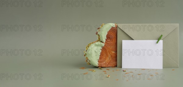 White empty mock up template paper note card Delicious fresh croissant topped with Matcha Green Tea