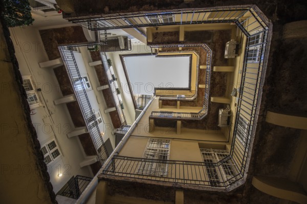 View upwards, inner courtyard of a block of houses. Typical of this type of building in the