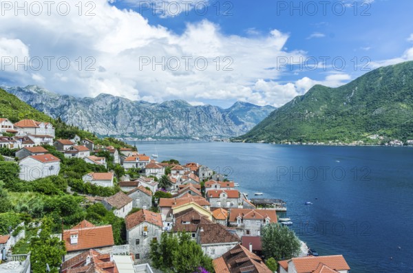 Top aerial panoramic view on old town Perast and Kotor bay on summer day in Montenegro