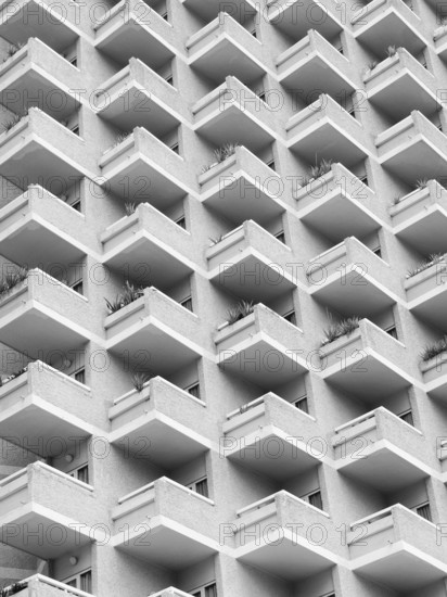 High rise building with residential flats or apartments in a white concrete development with