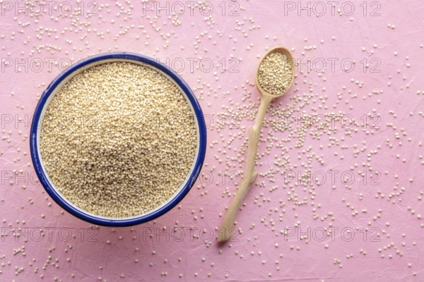 Quinoa in a bowl, healthy organic wood, uncooked, shot from above with copy space, Food