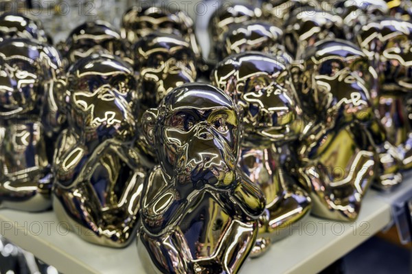 Monkey figures covering their mouths, a symbol of hearing, seeing and saying no evil, have become