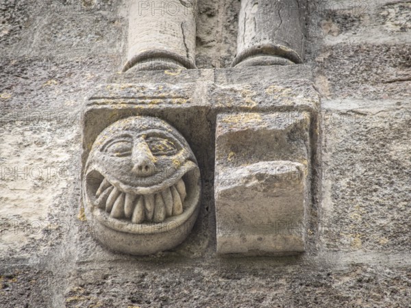 Sculpted face with sharp teeth, Sanctuary of Our Lady of Estíbaliz, Alava, basque country, spain