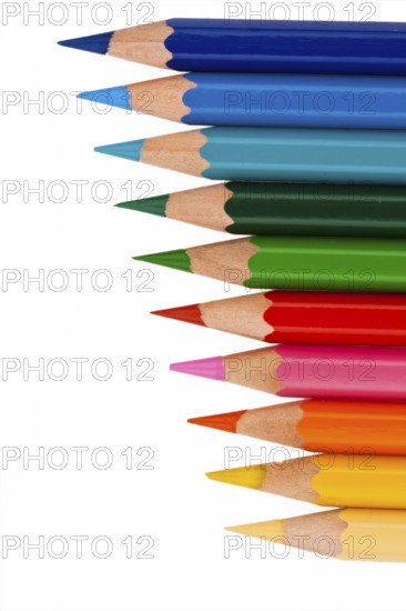 Many different coloured pencils on a white background, Many different colored pencils on white