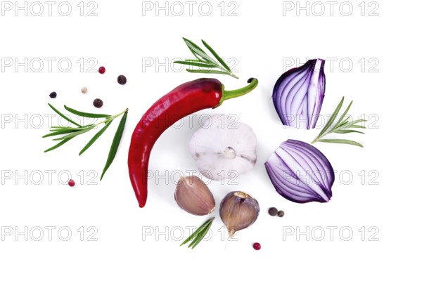 Pod of red hot pepper, slices of purple onion with sprigs of rosemary, garlic and peas of colored