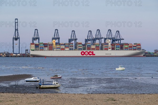 Container ship, container gantry cranes, boats, harbour, Harwich, Suffolk, England, Great Britain
