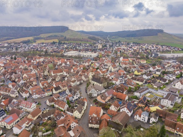 Aerial view of a village with red roofs and hills in a rural setting, Großbottwar, Ludwigsburg