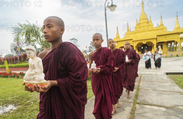 NAMSAI, INDIA.- APRIL 16: Buddhist monks carries the idol of Lord Buddha as they celebrate the