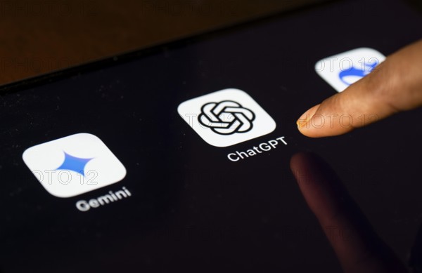 In this photo Illustration a person taps ChatGPT app icon on a tablet device on 24 May 2025 in New