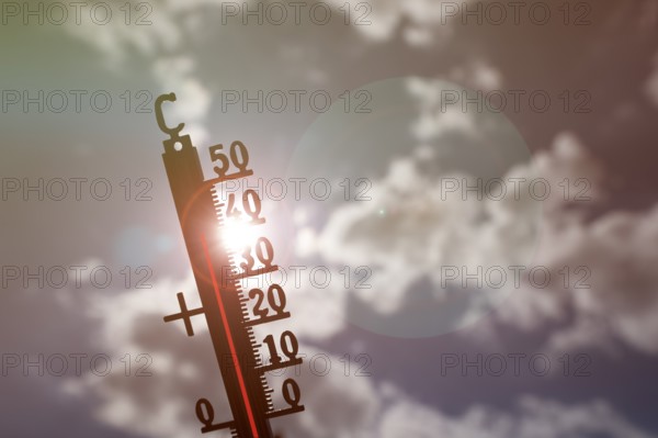 Symbolic image heat wave, thermometer in the sun, summer, climate change, temperature, record heat,